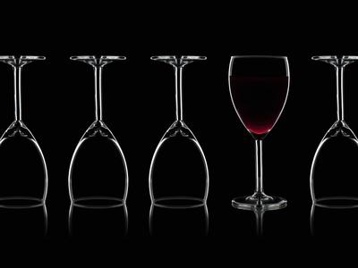 Row of Wine Glasses and a Glass of Red Wine Against a Black Background'  Photographic Print - Shawn Hempel 