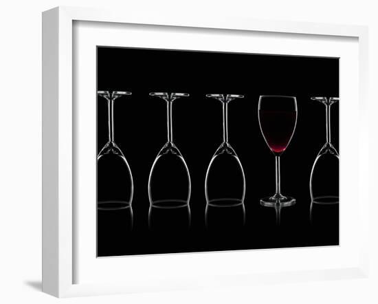 Row of Wine Glasses and a Glass of Red Wine Against a Black Background-Shawn Hempel-Framed Photographic Print
