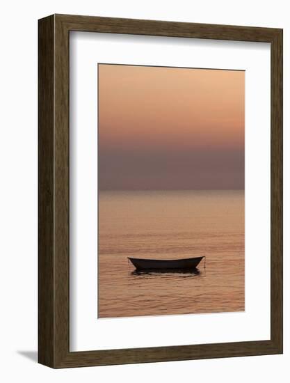 Rowboat at anchor in the water at sunset.-Tom Haseltine-Framed Photographic Print