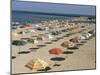 Rows of Open Beach Umbrellas Lining a Sandy Cape Cod Beach-Dmitri Kessel-Mounted Photographic Print