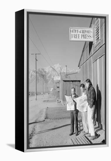 Roy Takeno (Editor) and Group Reading Manzanar Paper [I.E. Los Angeles Times] in Front of Office-Ansel Adams-Framed Stretched Canvas