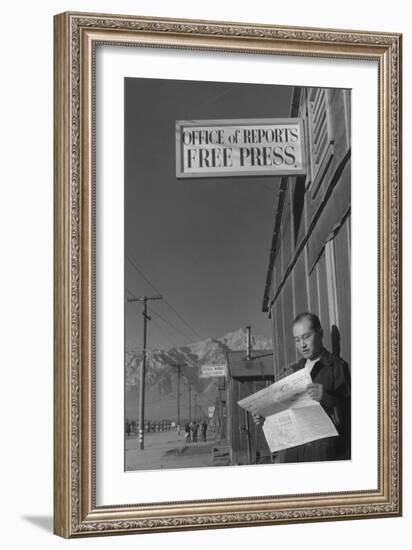 Roy Takeno Reading Paper in Front of Office-Ansel Adams-Framed Art Print