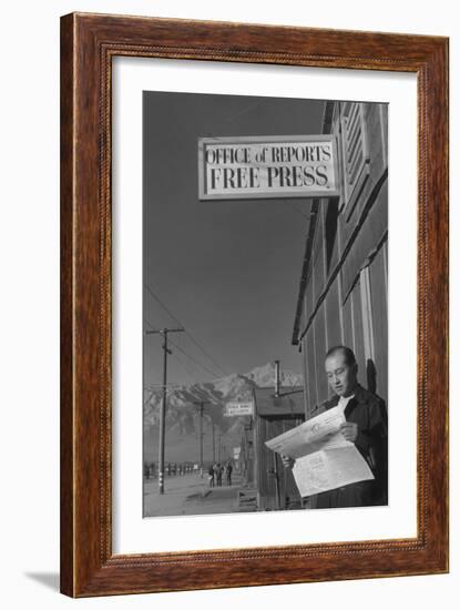 Roy Takeno Reading Paper in Front of Office-Ansel Adams-Framed Art Print