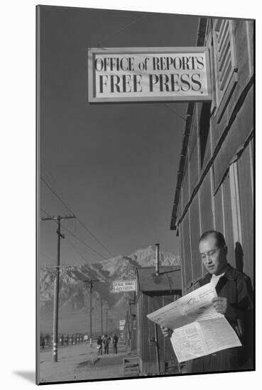 Roy Takeno Reading Paper in Front of Office-Ansel Adams-Mounted Art Print