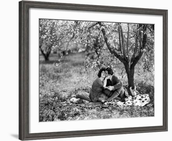 Rudolph Valentino with Alla Nazimova Under Blossom Tree, 1921-null-Framed Art Print