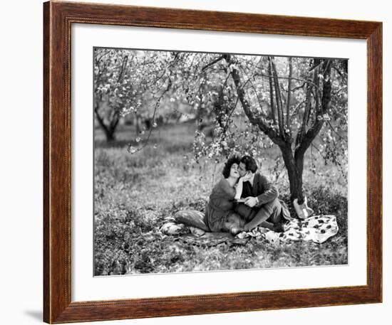 Rudolph Valentino with Alla Nazimova Under Blossom Tree, 1921-null-Framed Art Print