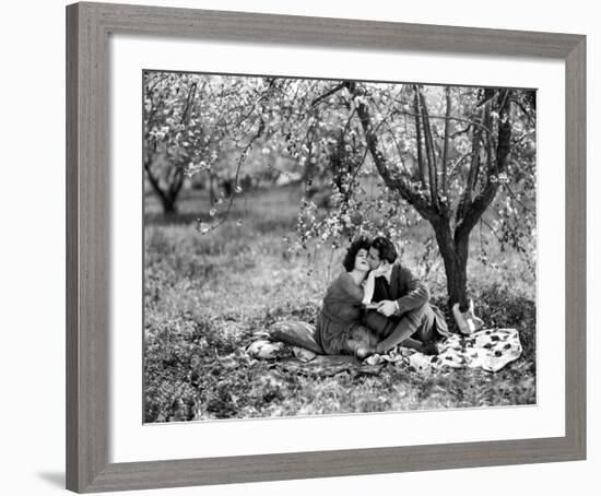 Rudolph Valentino with Alla Nazimova Under Blossom Tree, 1921-null-Framed Art Print