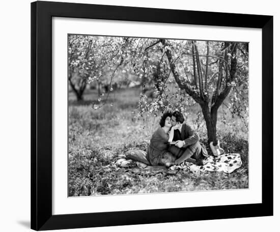 Rudolph Valentino with Alla Nazimova Under Blossom Tree, 1921-null-Framed Art Print
