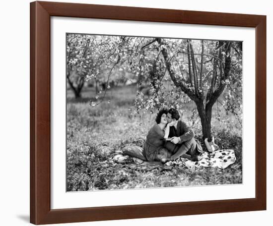 Rudolph Valentino with Alla Nazimova Under Blossom Tree, 1921--Framed Art Print