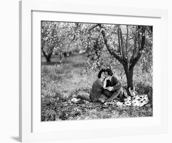 Rudolph Valentino with Alla Nazimova Under Blossom Tree, 1921--Framed Art Print