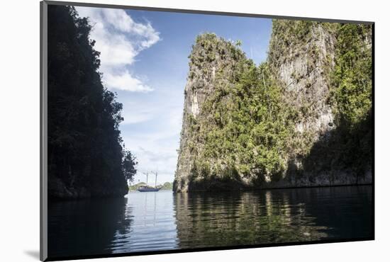 Rugged Limestone Islands Frame an Indonesian Pinisi Schooner-Stocktrek Images-Mounted Photographic Print