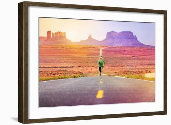 Runner Man Athlete Running Sprinting on Road by Monument Valley. Concept with Sprinter Fast Trainin-Maridav-Framed Photographic Print