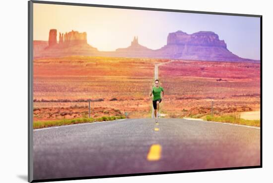 Runner Man Athlete Running Sprinting on Road by Monument Valley. Concept with Sprinter Fast Trainin-Maridav-Mounted Photographic Print