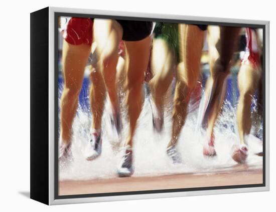 Runners Legs Splashing Through Water Jump of Track and Field Steeplechase Race, Sydney, Australia-Paul Sutton-Framed Premier Image Canvas