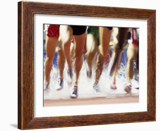 Runners Legs Splashing Through Water Jump of Track and Field Steeplechase Race, Sydney, Australia-Paul Sutton-Framed Photographic Print