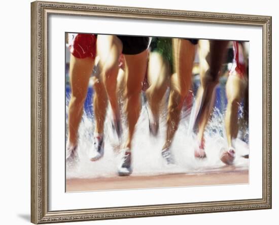 Runners Legs Splashing Through Water Jump of Track and Field Steeplechase Race, Sydney, Australia-Paul Sutton-Framed Photographic Print