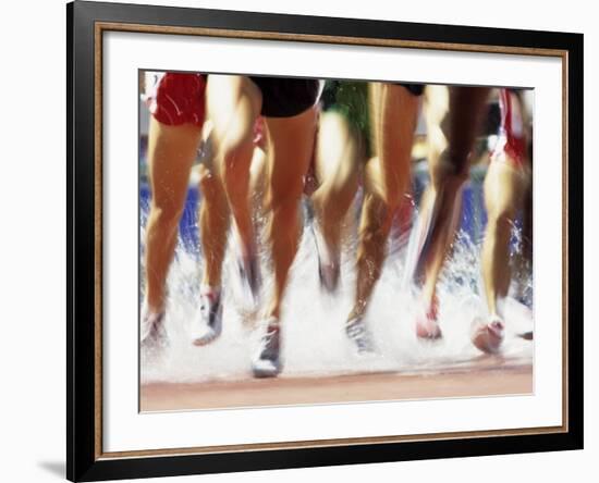 Runners Legs Splashing Through Water Jump of Track and Field Steeplechase Race, Sydney, Australia-Paul Sutton-Framed Photographic Print