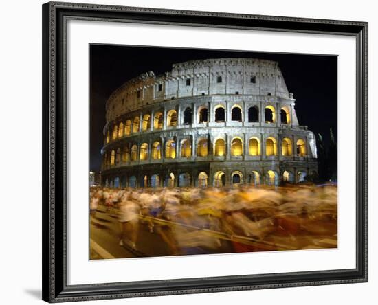 Runners Make Their Way Past the Colosseum in Rome-null-Framed Photographic Print