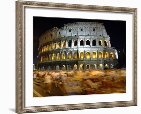 Runners Make Their Way Past the Colosseum in Rome--Framed Photographic Print