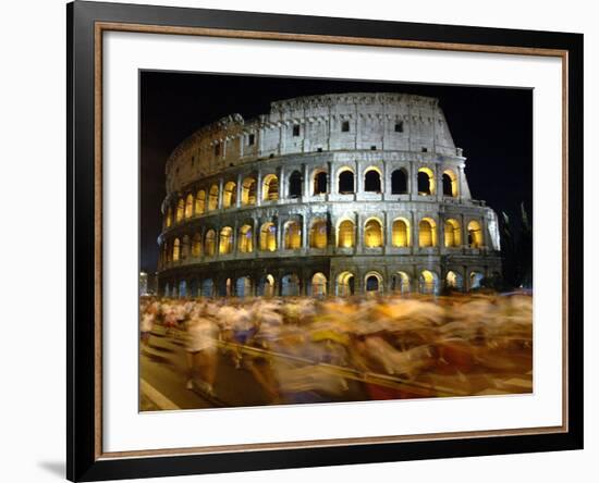 Runners Make Their Way Past the Colosseum in Rome-null-Framed Photographic Print