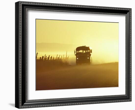 Rural School Bus Driving Along Dusty Country Road, Oregon, USA-William Sutton-Framed Photographic Print