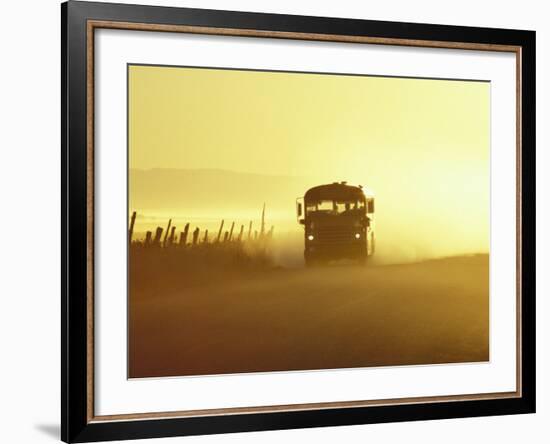 Rural School Bus Driving Along Dusty Country Road, Oregon, USA-William Sutton-Framed Photographic Print