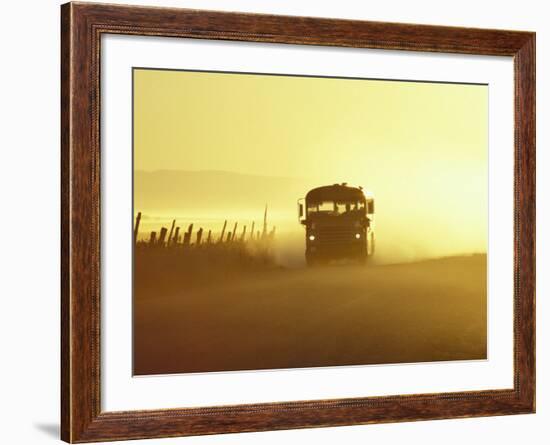 Rural School Bus Driving Along Dusty Country Road, Oregon, USA-William Sutton-Framed Photographic Print