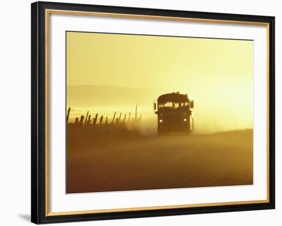 Rural School Bus Driving Along Dusty Country Road, Oregon, USA-William Sutton-Framed Photographic Print