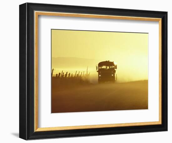 Rural School Bus Driving Along Dusty Country Road, Oregon, USA-William Sutton-Framed Photographic Print