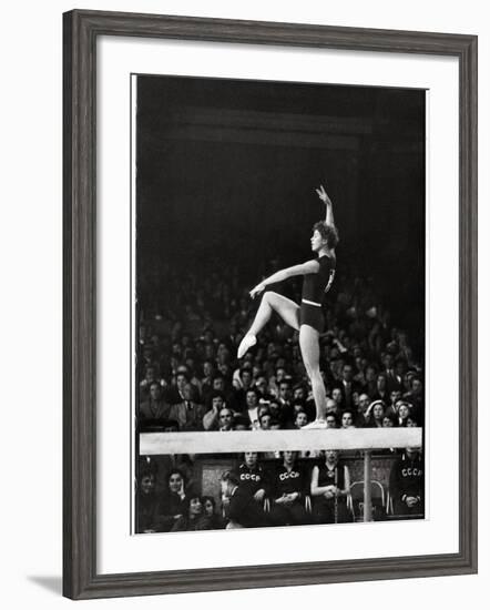 Russian Gymnast Larisa Latynina Competing on the High Beam in the Olympics-John Dominis-Framed Premium Photographic Print