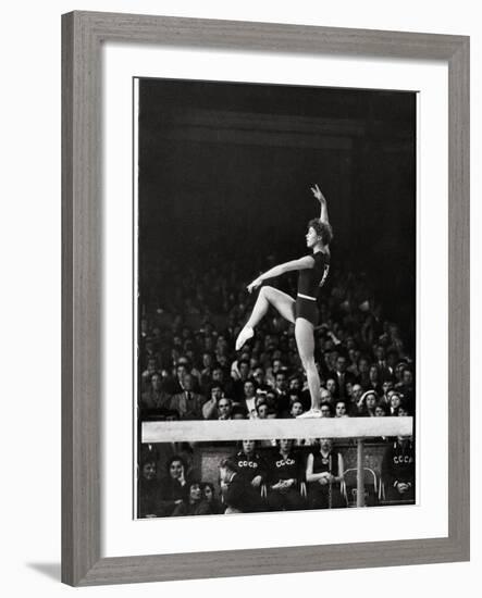 Russian Gymnast Larisa Latynina Competing on the High Beam in the Olympics-John Dominis-Framed Premium Photographic Print