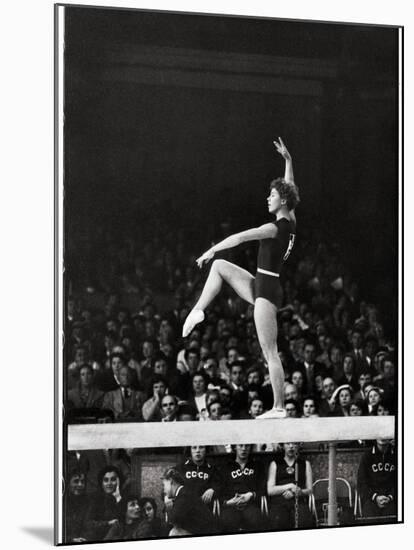 Russian Gymnast Larisa Latynina Competing on the High Beam in the Olympics-John Dominis-Mounted Premium Photographic Print