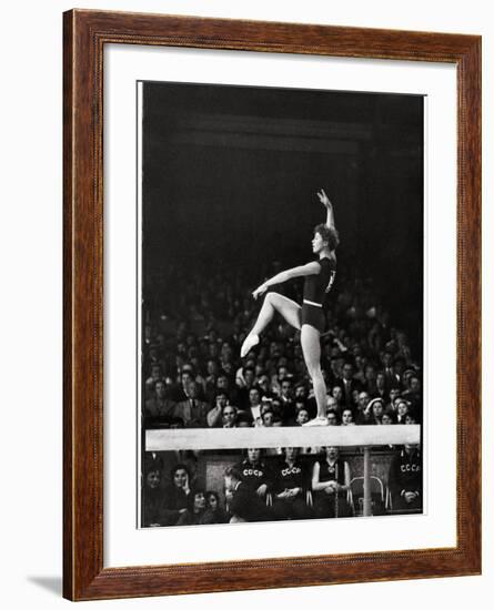 Russian Gymnast Larisa Latynina Competing on the High Beam in the Olympics-John Dominis-Framed Premium Photographic Print