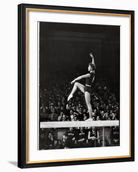 Russian Gymnast Larisa Latynina Competing on the High Beam in the Olympics-John Dominis-Framed Premium Photographic Print