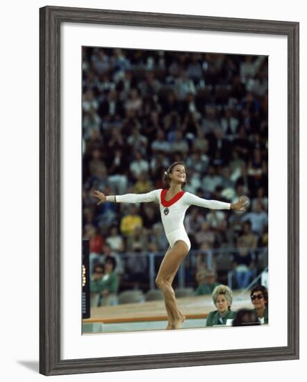 Russian Gymnast Olga Korbut Performing Floor Exercises at Summer Olympics-John Dominis-Framed Premium Photographic Print