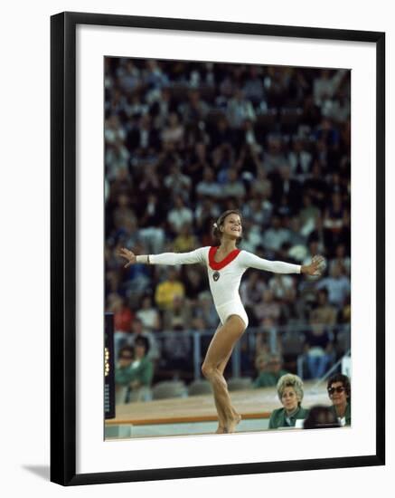 Russian Gymnast Olga Korbut Performing Floor Exercises at Summer Olympics-John Dominis-Framed Premium Photographic Print