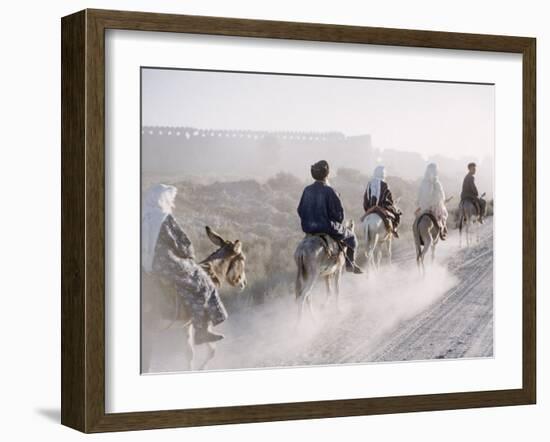 Russian Look of the Land Essay: Donkeys Carring Moslem Peasants on Dusty Road-Howard Sochurek-Framed Photographic Print