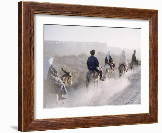 Russian Look of the Land Essay: Donkeys Carring Moslem Peasants on Dusty Road-Howard Sochurek-Framed Photographic Print