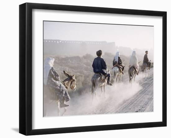 Russian Look of the Land Essay: Donkeys Carring Moslem Peasants on Dusty Road-Howard Sochurek-Framed Photographic Print