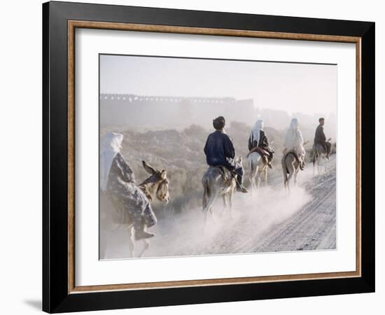 Russian Look of the Land Essay: Donkeys Carring Moslem Peasants on Dusty Road-Howard Sochurek-Framed Photographic Print