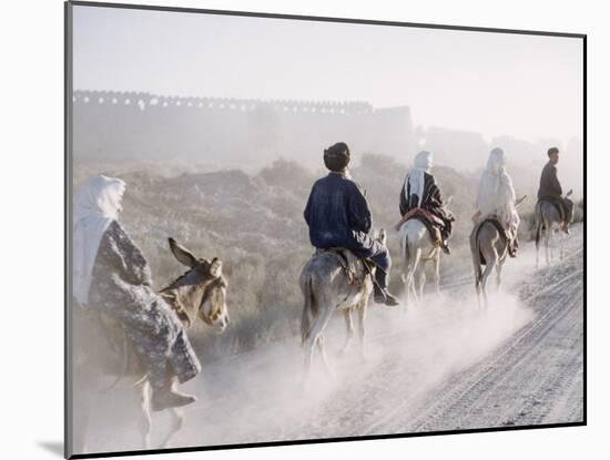 Russian Look of the Land Essay: Donkeys Carring Moslem Peasants on Dusty Road-Howard Sochurek-Mounted Photographic Print