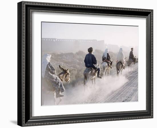 Russian Look of the Land Essay: Donkeys Carring Moslem Peasants on Dusty Road-Howard Sochurek-Framed Photographic Print