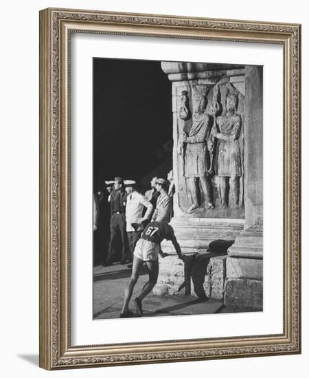 Russian Olympic Runner Rests on Constantines Arch, after Placing 4th in Marathon-null-Framed Photographic Print