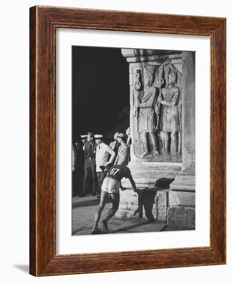 Russian Olympic Runner Rests on Constantines Arch, after Placing 4th in Marathon-null-Framed Photographic Print