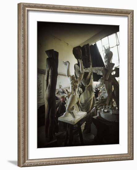 Russian Sculptor Ossip Zadkine Sitting in His Paris Studio Among Towering Sculptures-Gjon Mili-Framed Premium Photographic Print