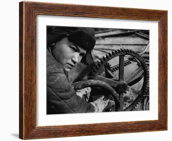 Russian Steel Worker Turning Gear Wheel in a Steel Mill-Margaret Bourke-White-Framed Photographic Print