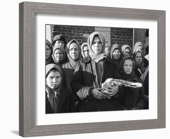 Russian Woman Grimly Holding a Slab of Meat as Other Peasant Women Staunchly Stand by in Siberia-Margaret Bourke-White-Framed Photographic Print