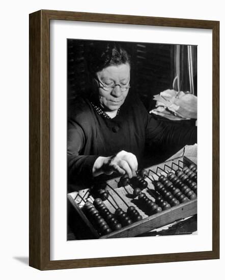 Russian Woman Using an Abacus to Calculate Numbers in Business-Margaret Bourke-White-Framed Photographic Print