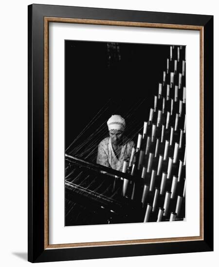 Russian Woman Working at Cloth Weaving Machine in a Textile Mill-Margaret Bourke-White-Framed Photographic Print