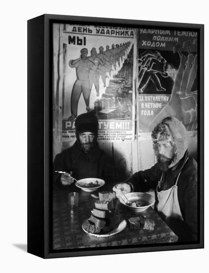 Russian Workers Eating Black Bread and Soup at Table with Soviet Communist Workers Posters, Siberia-Margaret Bourke-White-Framed Premier Image Canvas